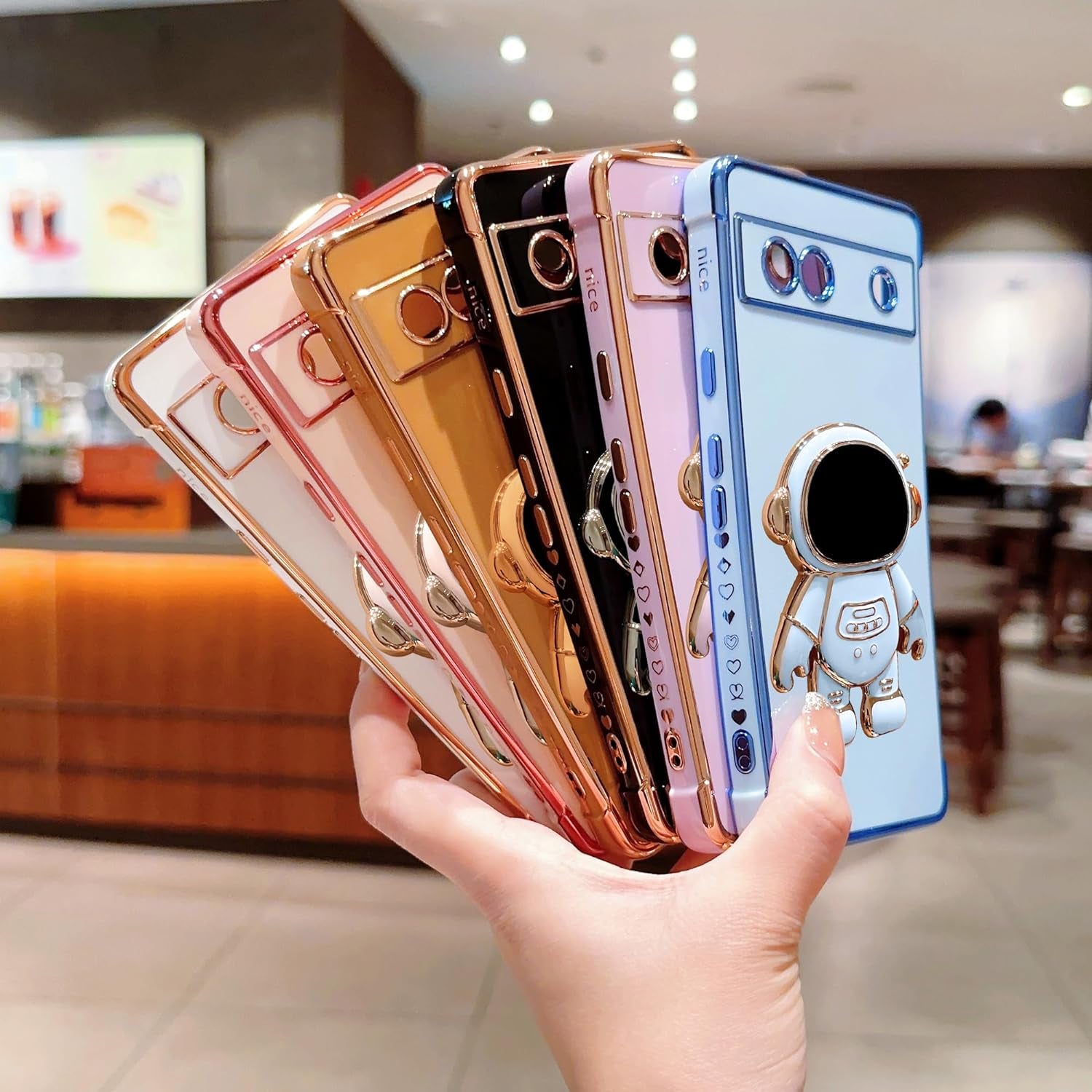 Phylla Phone Case for Google Pixel 7A 6.1” 5G,Luxury Plating Astronaut Stand Holder Phone Case with Cute Love Heart Side Small Pattern Soft Silicone Shockproof Kickstand Cover Bumper (Pink)  phylla   